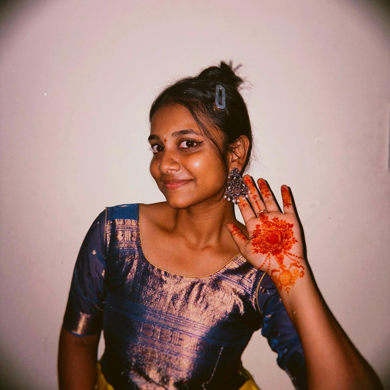 Jayani Bai showing off intricate henna on her palm