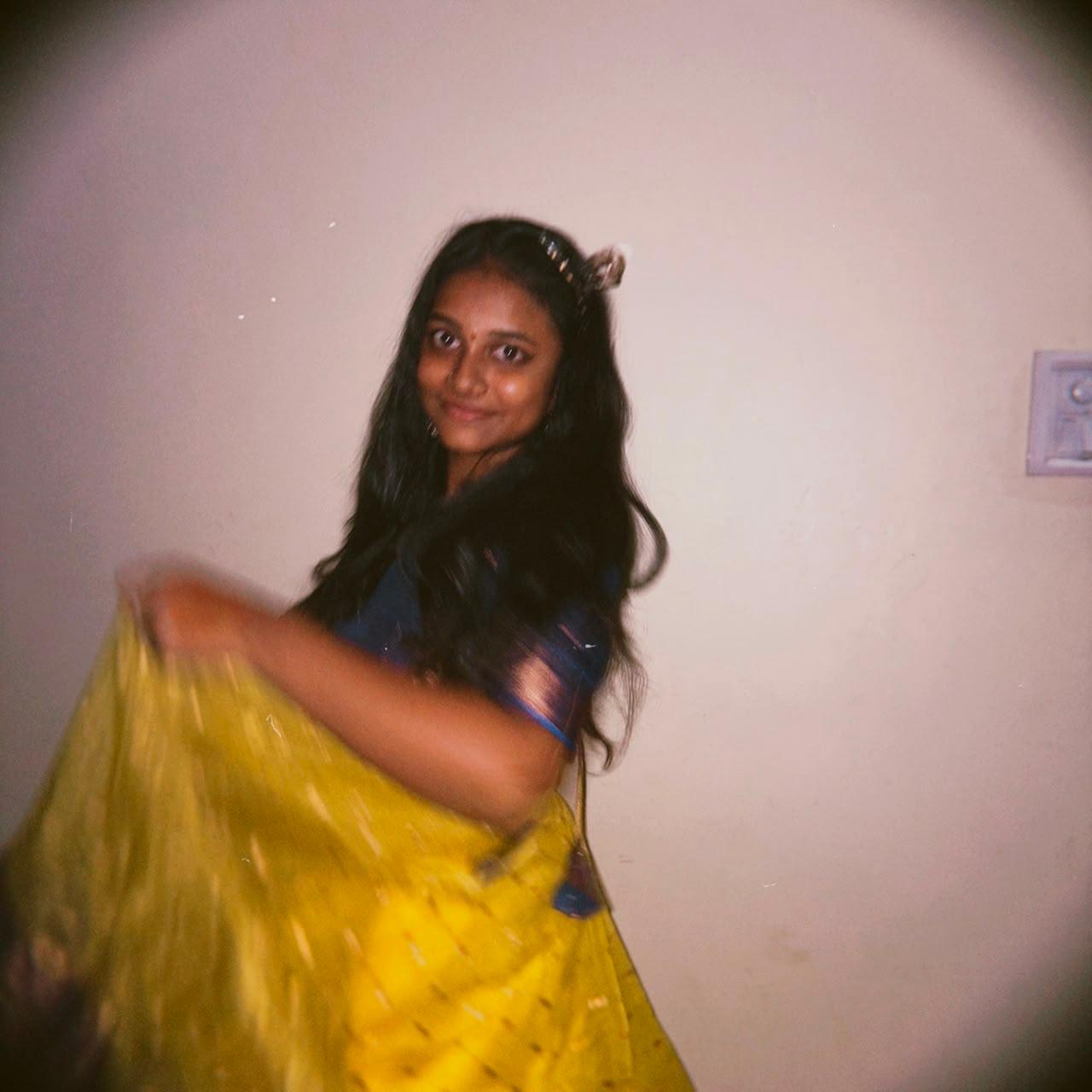 Jayani Bai twirling in a yellow saree